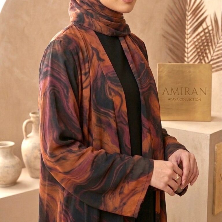 Woman wearing black and rust marble printed chiffon abaya with lace work on sleeves and matching hijab for modest wear
